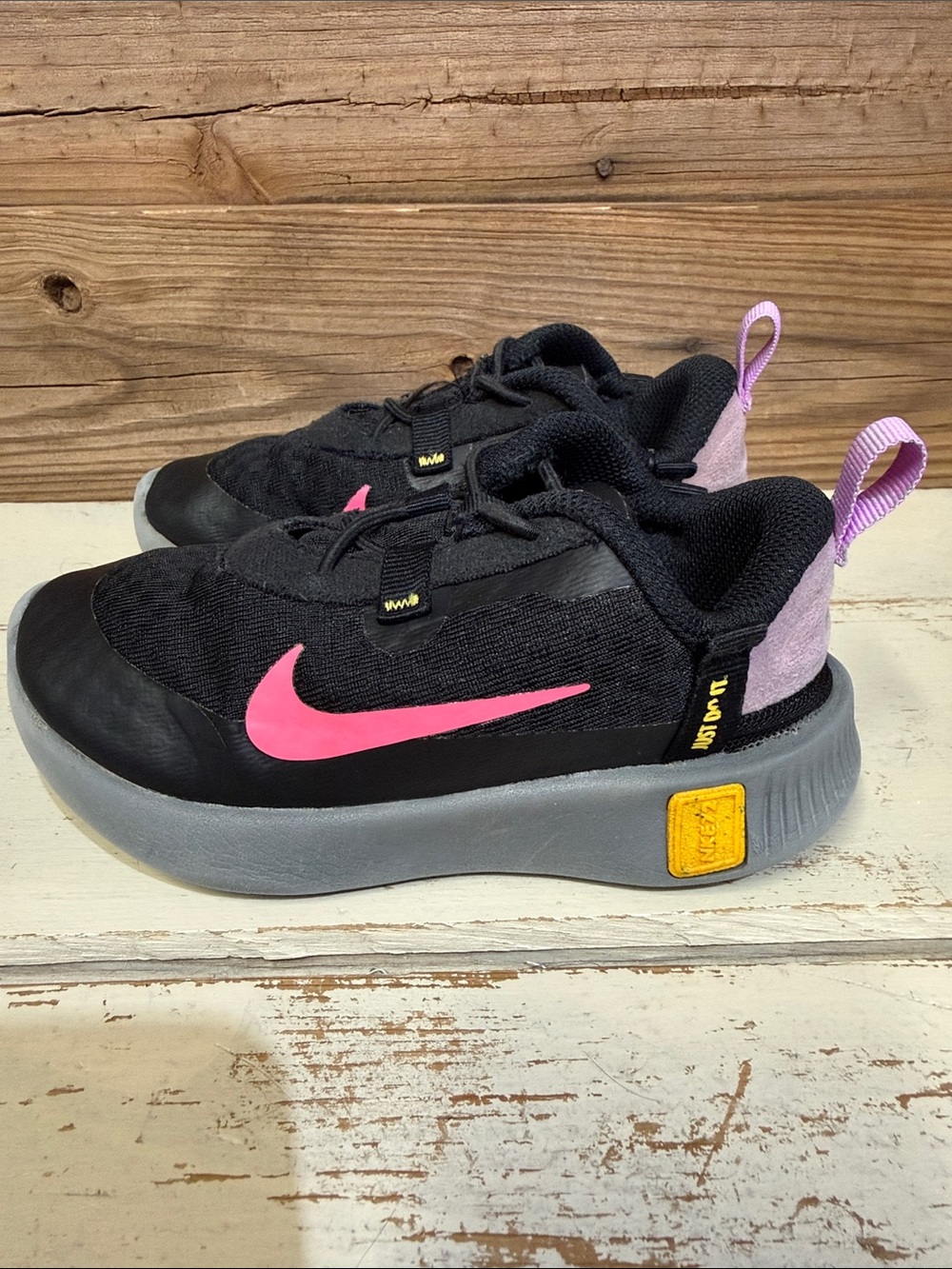 Nike Kids Black Sneakers with Pink and Yellow Accents